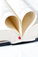 Pages of a Bible curved into a heart shape photo