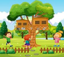 tres niños jugando en la casa del árbol. vector