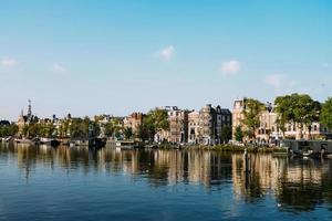 City skyline across body of water photo