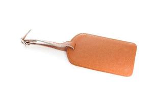 Brown leather label tag with string, isolated on the white photo