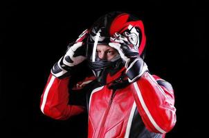 biker holding his helmet with both hands