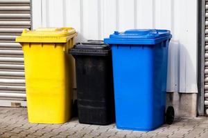Three recycle bins on the street photo