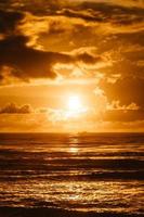 Bright sundown over sea water photo