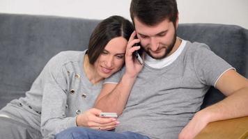 Couple using smartphones video