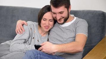 Couple watching videos on smartphone