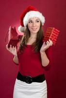 Young Woman with Santa Hat and Gift