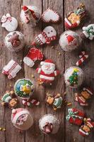 Christmas sweets closeup on a wooden table. vertical top view