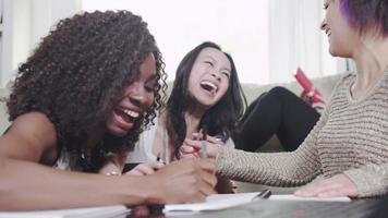 Girls having fun studying or working together video