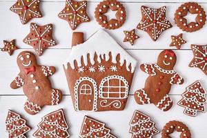 Gingerbreand cookies christmas composition, house man and woman couple, stars photo