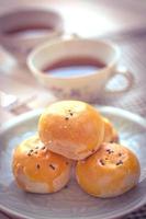 Chinese pastry moon cake with cup of tea photo