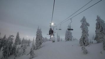 People on a ski lift photo