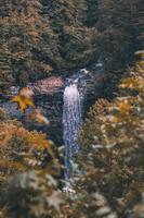 Waterfall in the mountains photo