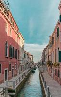 Scenic water canal under blue sky during daytime photo