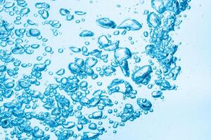 Bubbles in blue water background photo