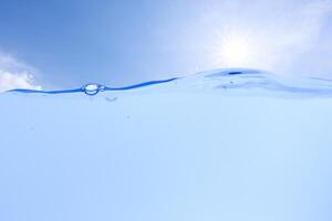 Underwater photo, the sky with the sun in the background photo