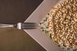 Fork on meringue pie dish photo