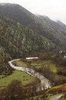 River in the middle of a mountain landscape  photo