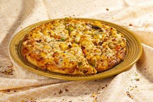 Indian Style of Italian Dish Paneer Pizza photo