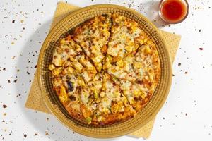 Indian style of Italian dish paneer pizza photo