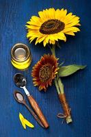 Sunflower oil and sunflower flowers photo
