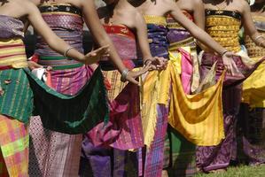Colourful Balinese Rejang dancers in traditional village ceremony