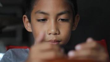 boy having fun with game in smartphone video