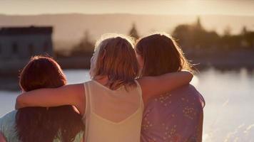 Three young women spending time together in the park video