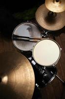 Drum set in a studio with drum sticks photo