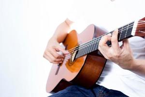 Musician plays Acoustic Guitar photo