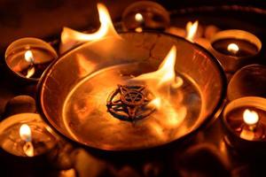 Ancient pentagram burning photo