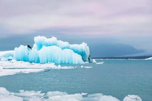 Blue icebergs in Jokulsarlon glacial lagoon photo
