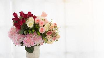 Artificial flowers in a vase photo