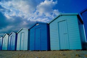 Blue sheds on the beach photo