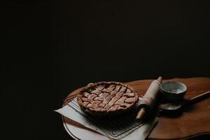 Baked pie on a brown table photo