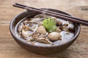 Beef Noodle Soup,Close up of a wooden bowl photo