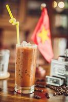 Vietnamese ice coffee with coffee beans photo