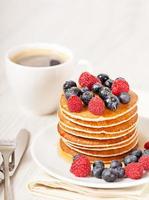 Stack of pancakes with berries breakfast photo