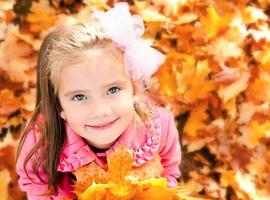 Autumn portrait of adorable little girl photo