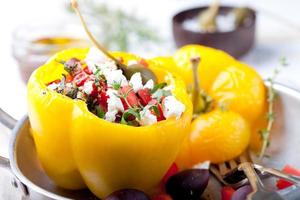 Baked stuffed bell peppers filled with cheese, capers and anchovies