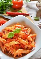 Penne pasta with chili sauce arrabiata photo