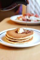 Pancakes with butter and syrup photo