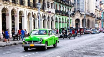 Street scene with vintage car in Havana, Cuba.