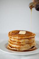 Stack of pancakes with maple syrup