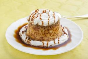 Pudding with cream and syrup photo