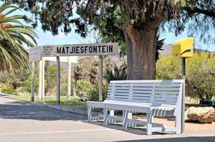 Bench and sign at Matjiesfontein station photo