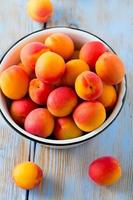 apricots on wooden surface
