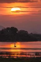 Fisherman in Arugam bay lagoon sunset, Sri Lanka photo