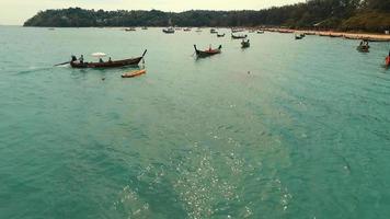 Aerial: Flying close to the long tail boat. video