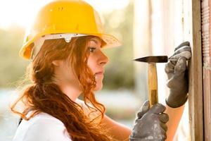 Woman Bricklayer with Hammer photo