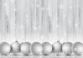 Christmas baubles on a snowflake and wooden background vector